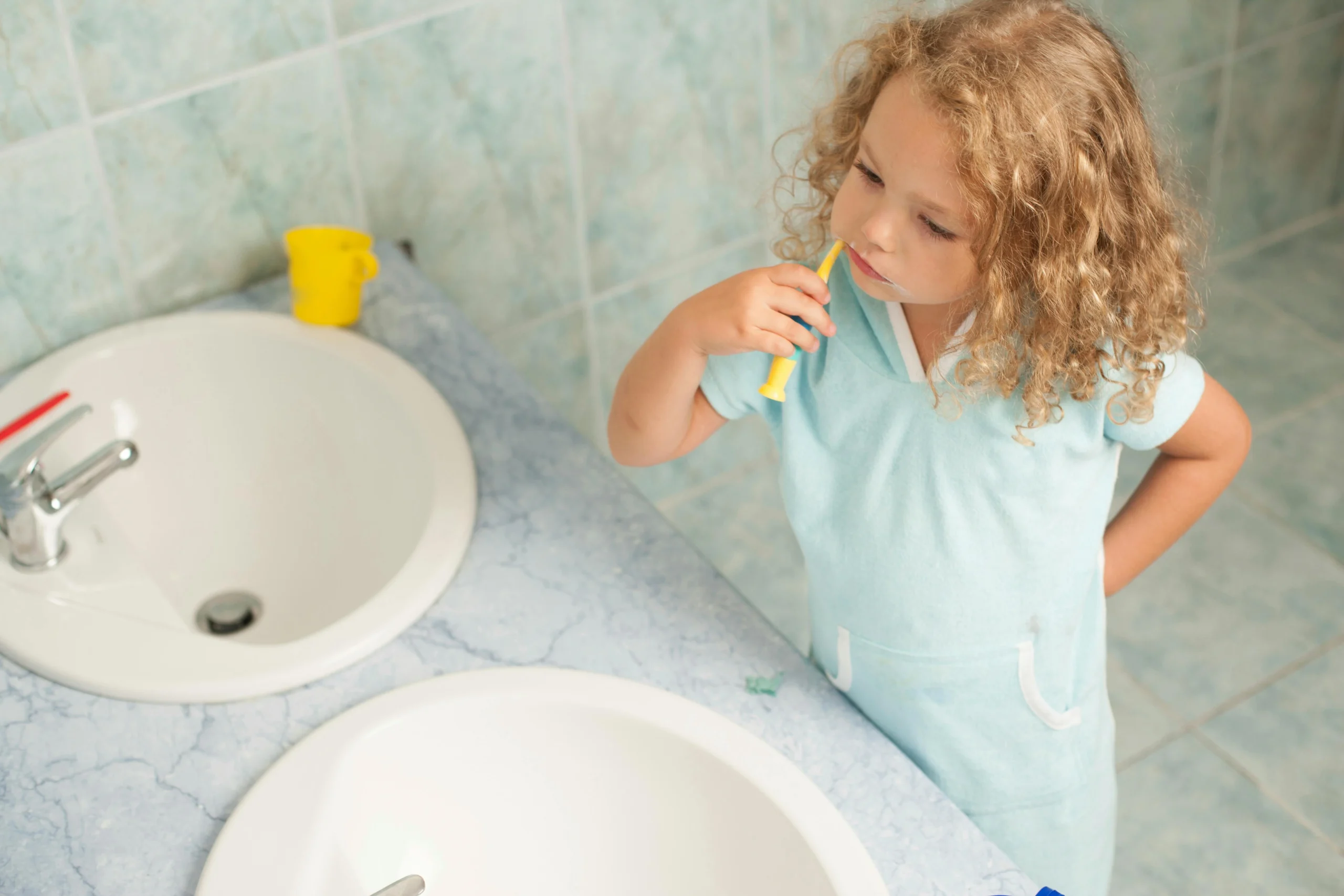 Girl brushing her teeth