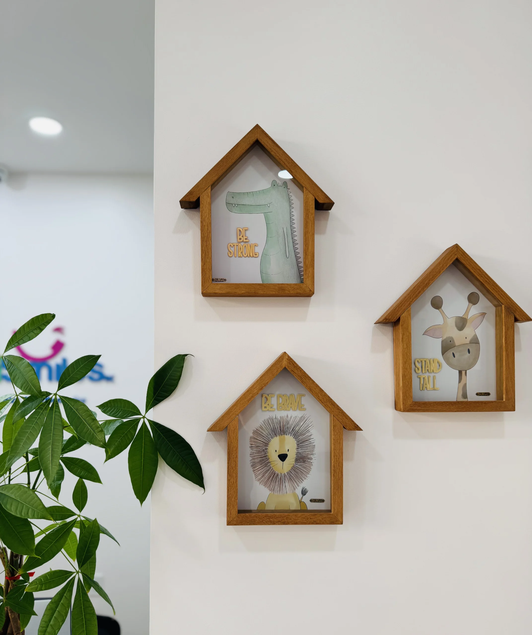 photo of three cartoon animal wall art pieces on a wall for pediatric dentist in yorba linda ca