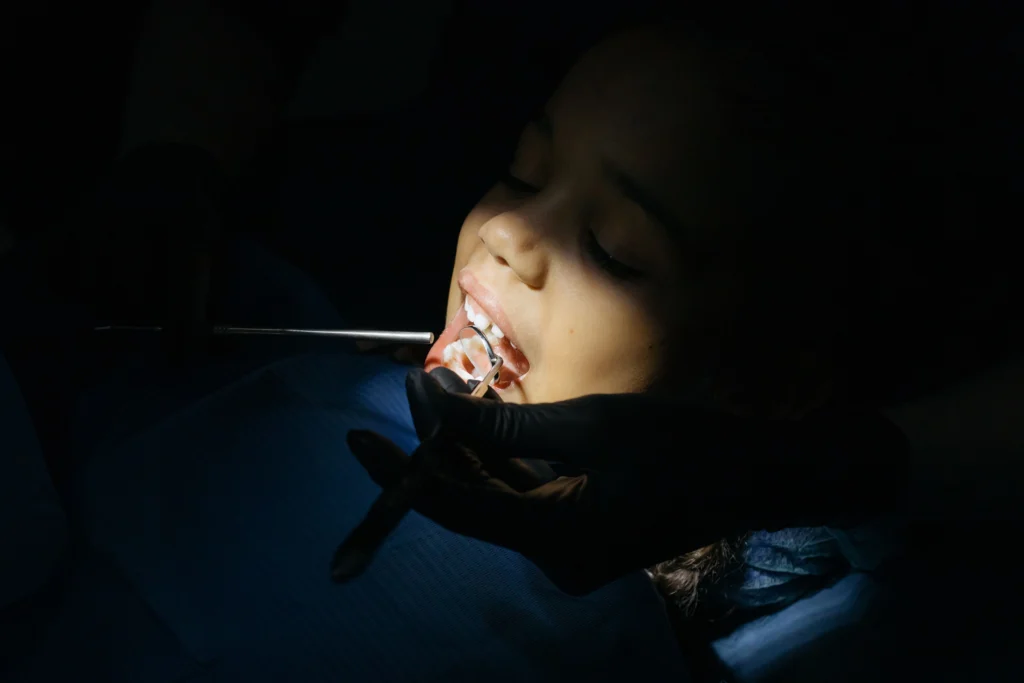 photo-of-a-child-getting-their-teeth-checked-for-pediatric-dental-crowns