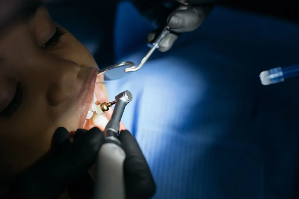 photo-of-a-child-getting-their-teeth-cleaned-at-a-dentist-office