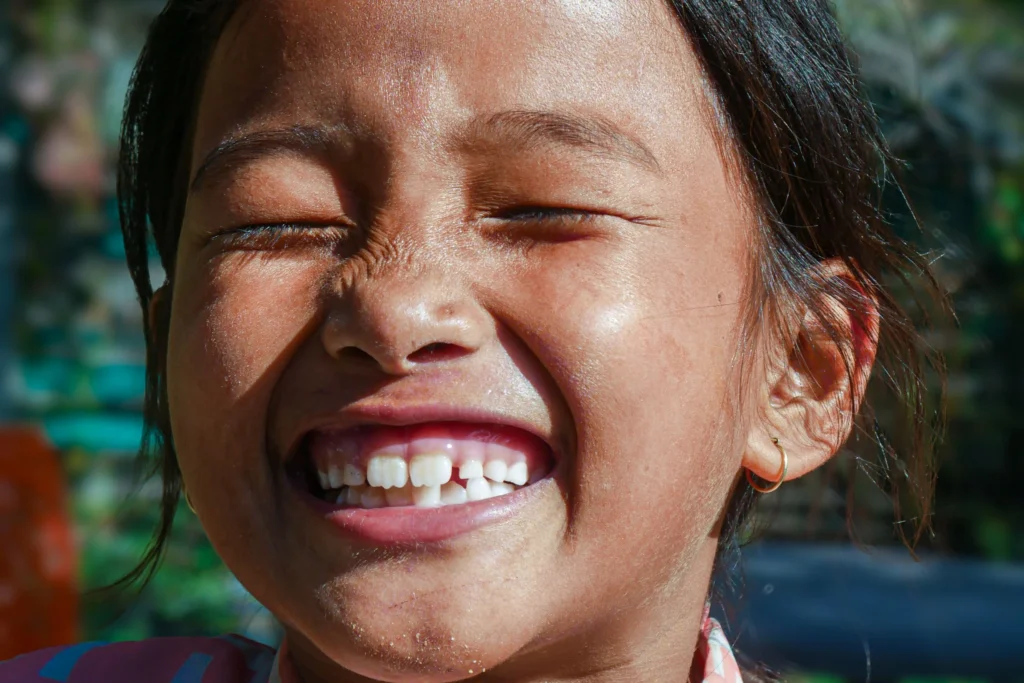 photo-of-a-girl-smiling-with-her-teeth-for-pediatric-dental-crowns
